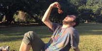 Man eating grapes